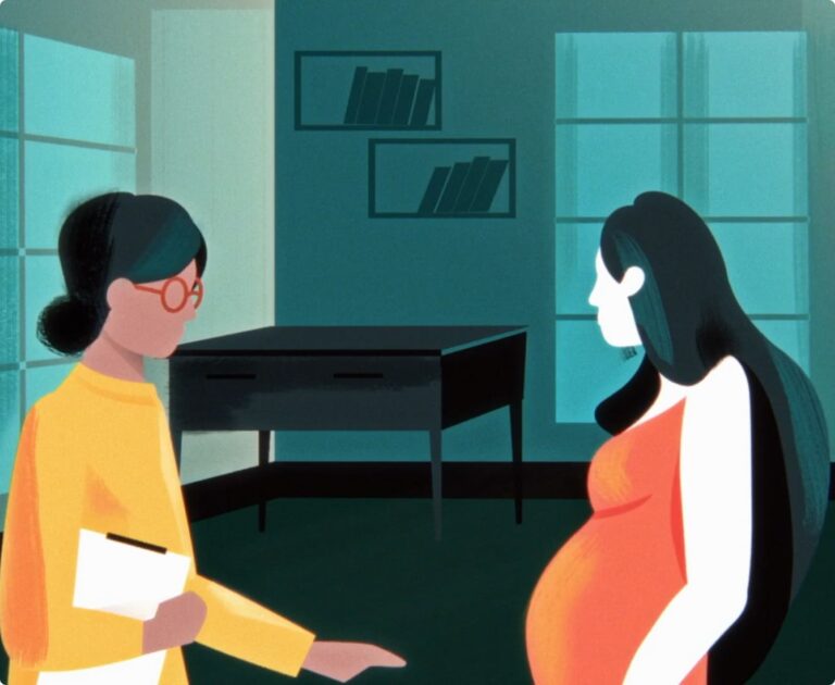 A pregnant woman in an orange dress talks to a person with glasses and a clipboard. They are in a dimly lit room with shelves and a desk.