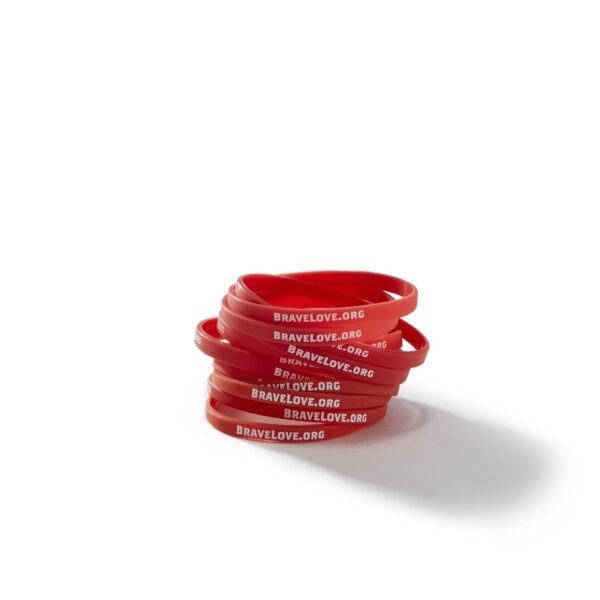 A pack of 10 red silicone wristbands with white text that reads "BRAVELOVE.ORG," displayed on a white background.