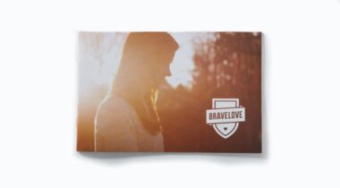 Brochure featuring a silhouette of a woman with long hair and the BraveLove logo on a sunny outdoor background.