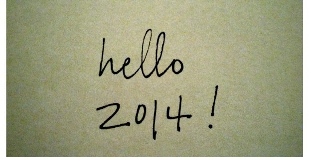 Handwritten note on beige paper saying "hello 2014!" in black ink.