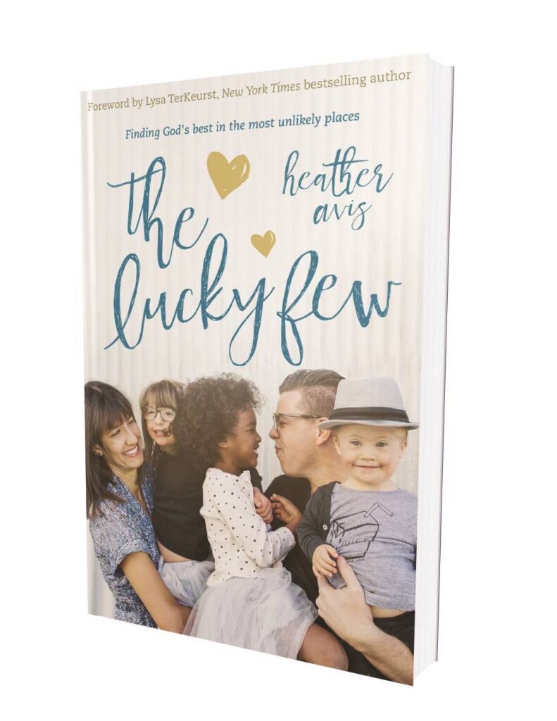 Book cover of "The Lucky Few" by Heather Avis, showing a smiling family with three children, including one with Down syndrome.