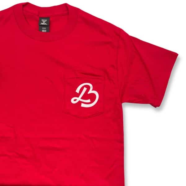 New Logo! Red T-Shirt featuring a white stylized "B" logo on the pocket.